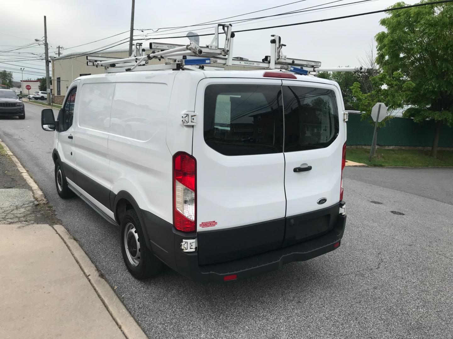 2018 White /Gray Ford Transit 150 (1FTYE1YM1JK) with an 3.7 V6 engine, Automatic transmission, located at 577 Chester Pike, Prospect Park, PA, 19076, (610) 237-1015, 39.886154, -75.302338 - 2018 Ford Transit 150: Dual drop down ladder racks, multiple pieces of shelving, power inverter w/ outlet, heavy duty partition, FLEET MAINTAINED, runs LIKE NEW! This vehicle comes inspected and has been given a bumper to bumper safety check. It is very clean, reliable, and well maintained. We of - Photo#5